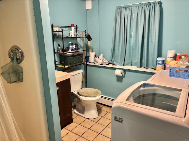 3 Millstream Rd, Hebron, CT 06231 - bathroom featuring baseboard heating, tile patterned floors, and washer / dryer