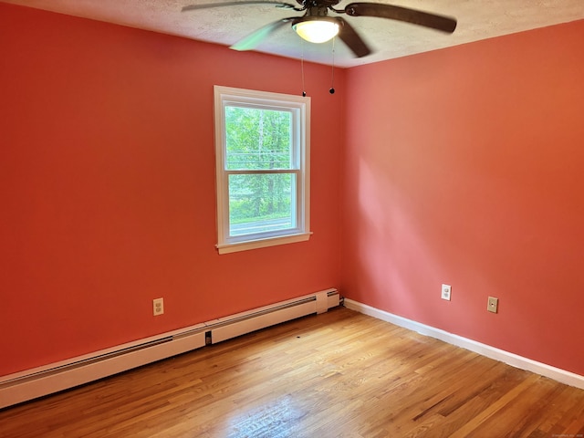 3 Millstream Rd, Hebron, CT 06231 - empty room featuring a baseboard radiator, ceiling fan, light wood-type flooring, and a textured ceiling