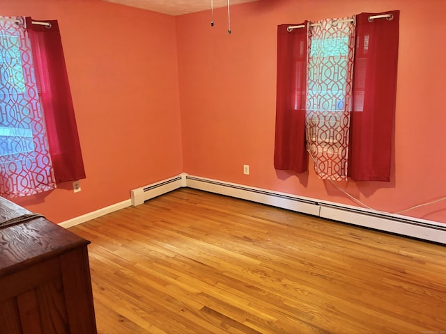 3 Millstream Rd, Hebron, CT 06231 - spare room with light wood finished floors and baseboard heating