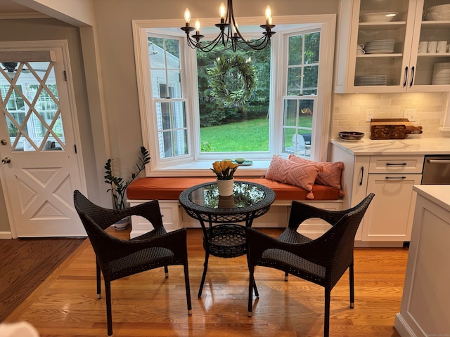 475 Riverside Dr, Cheshire, CT 06410 - dining space with a chandelier, plenty of natural light, and light wood finished floors