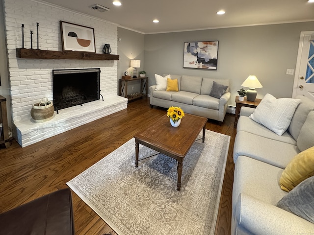 475 Riverside Dr, Cheshire, CT 06410 - living area featuring ornamental molding, wood finished floors, recessed lighting, and a brick fireplace