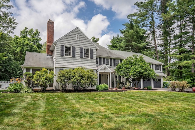 35 Walker Ln, West Hartford, CT 06117 - view of front facade featuring a chimney and a garage