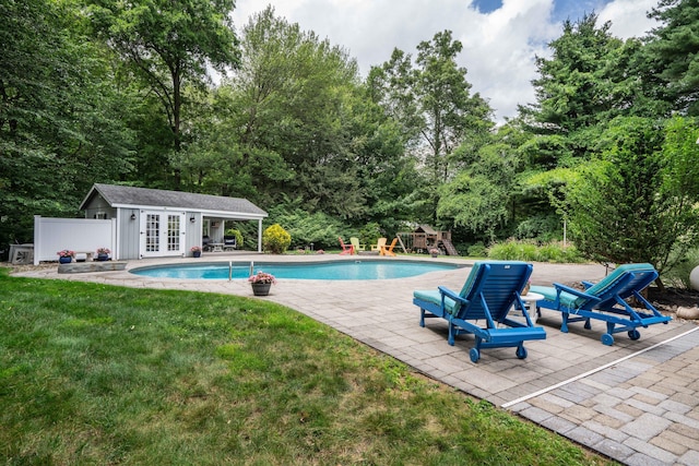 35 Walker Ln, West Hartford, CT 06117 - outdoor pool with french doors, a patio, a lawn, a playground, and a storage structure