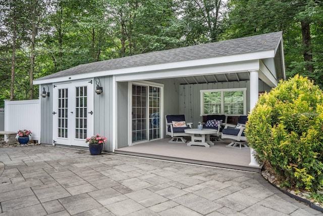 35 Walker Ln, West Hartford, CT 06117 - view of patio featuring a deck, an outdoor structure, and view of wooded area