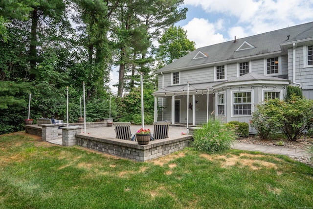 35 Walker Ln, West Hartford, CT 06117 - back of property with a patio area, a yard, and a shingled roof