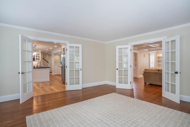 35 Walker Ln, West Hartford, CT 06117 - spare room featuring french doors, ornamental molding, wood finished floors, stairway, and recessed lighting