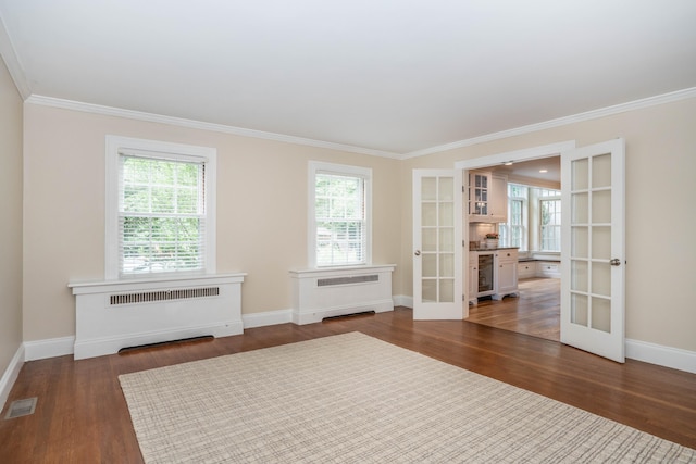 35 Walker Ln, West Hartford, CT 06117 - unfurnished room with french doors, radiator heating unit, wine cooler, crown molding, and plenty of natural light