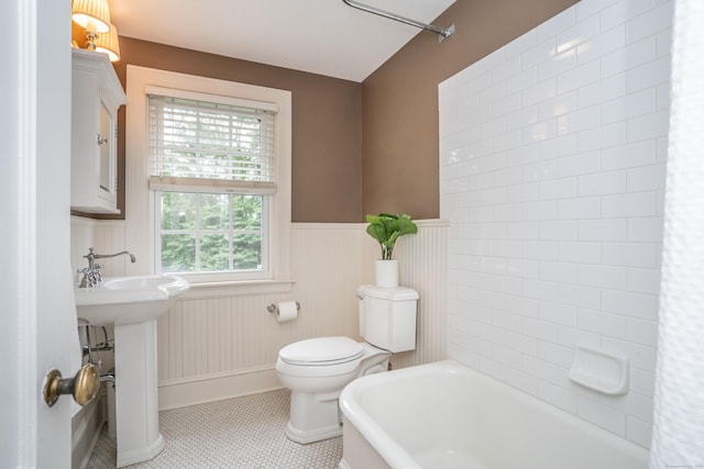 35 Walker Ln, West Hartford, CT 06117 - bathroom with a wainscoted wall and tile patterned floors