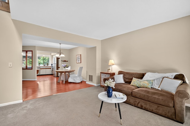 55 Wickhams Fancy Unit 55, Canton, CT 06019 - living room with carpet flooring, a chandelier, and wood finished floors