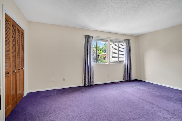 55 Wickhams Fancy Unit 55, Canton, CT 06019 - unfurnished bedroom featuring carpet floors, a textured ceiling, and a closet