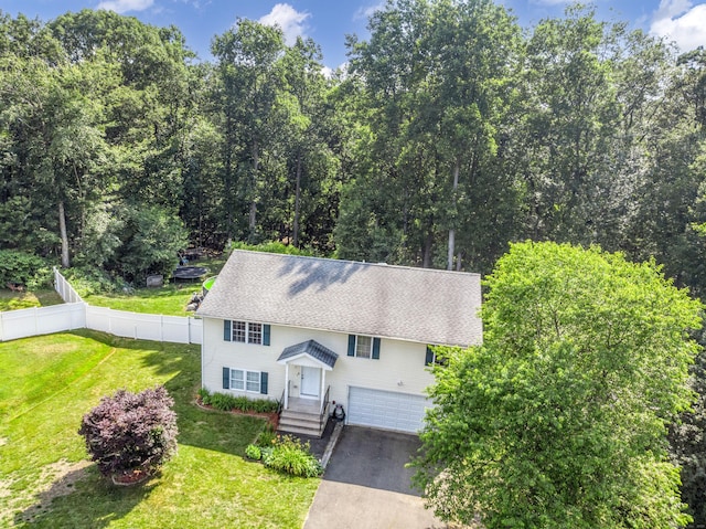 10 Leo Ln, Naugatuck, CT 06770 - view of front of property featuring a garage, driveway, and roof with shingles