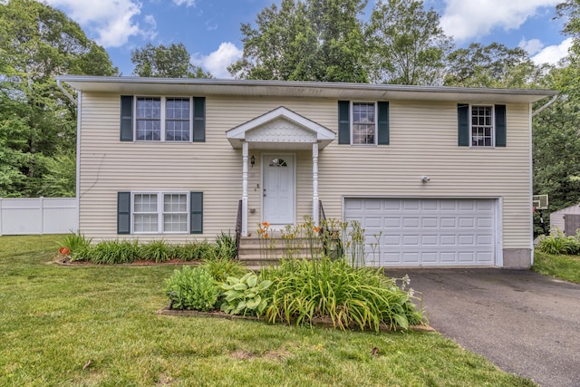 10 Leo Ln, Naugatuck, CT 06770 - bi-level home with asphalt driveway and an attached garage