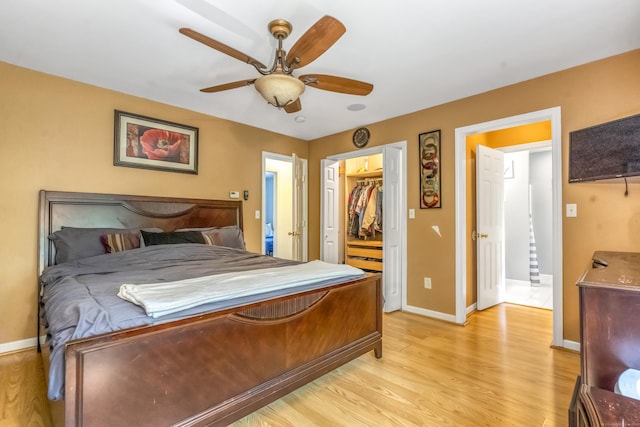 10 Leo Ln, Naugatuck, CT 06770 - bedroom with light wood-type flooring, ceiling fan, and a walk in closet