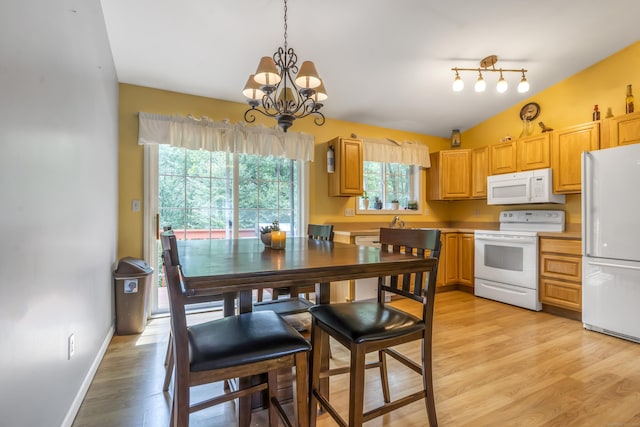 10 Leo Ln, Naugatuck, CT 06770 - kitchen featuring white appliances, light wood finished floors, a chandelier, hanging light fixtures, and light countertops