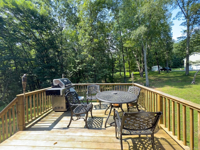 81 Lillis Rd, New Milford, CT 06776 - wooden deck with area for grilling, a lawn, and view of wooded area