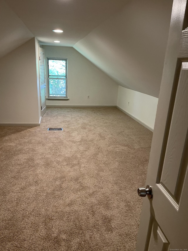 56 N Maple St, Enfield, CT 06082 - additional living space with lofted ceiling and carpet