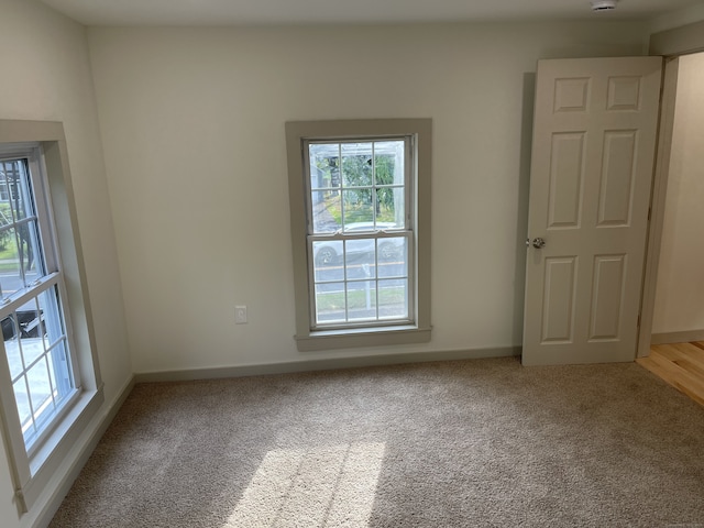 56 N Maple St, Enfield, CT 06082 - carpeted empty room featuring baseboards and a smoke detector