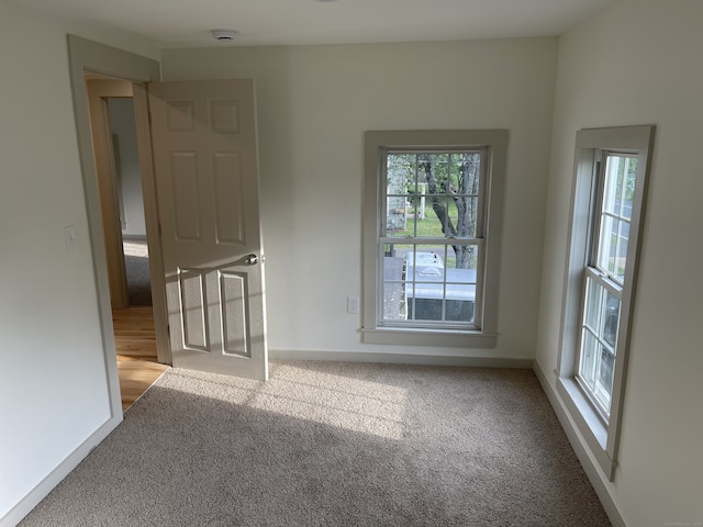 56 N Maple St, Enfield, CT 06082 - spare room featuring carpet and a smoke detector