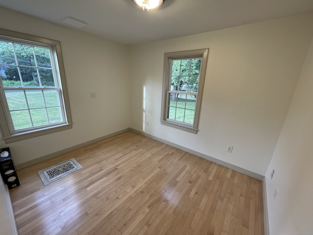56 N Maple St, Enfield, CT 06082 - spare room with healthy amount of natural light and light wood finished floors