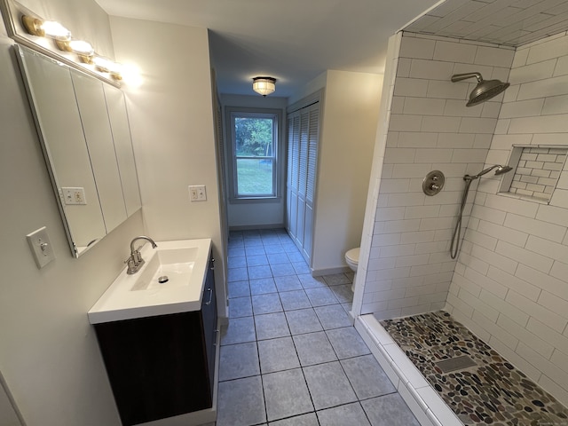 56 N Maple St, Enfield, CT 06082 - full bath featuring vanity, tiled shower, and tile patterned flooring