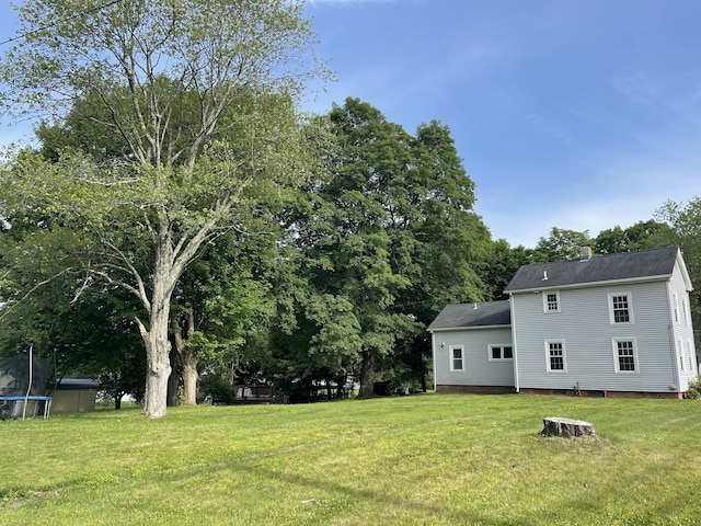 56 N Maple St, Enfield, CT 06082 - view of grassy yard with a trampoline