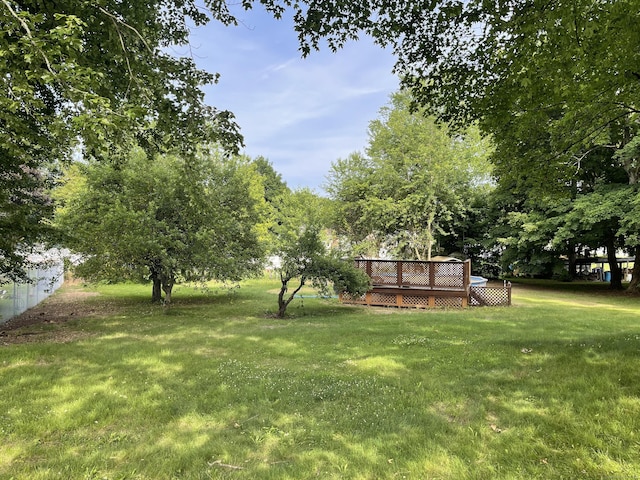 56 N Maple St, Enfield, CT 06082 - view of grassy yard featuring a deck
