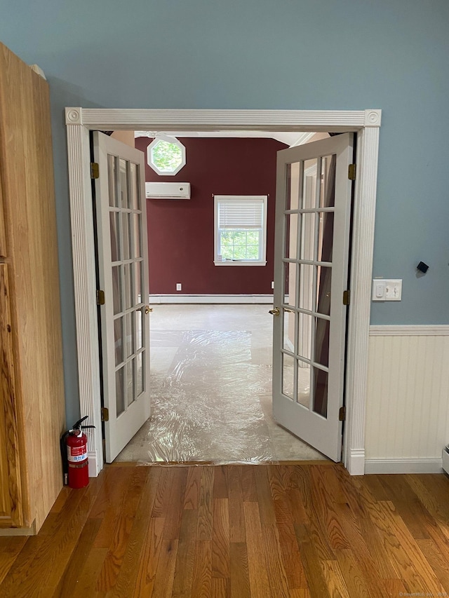 18 Bch Park Rd, Clinton, CT 06413 - hallway with french doors, wood finished floors, and a wall unit AC