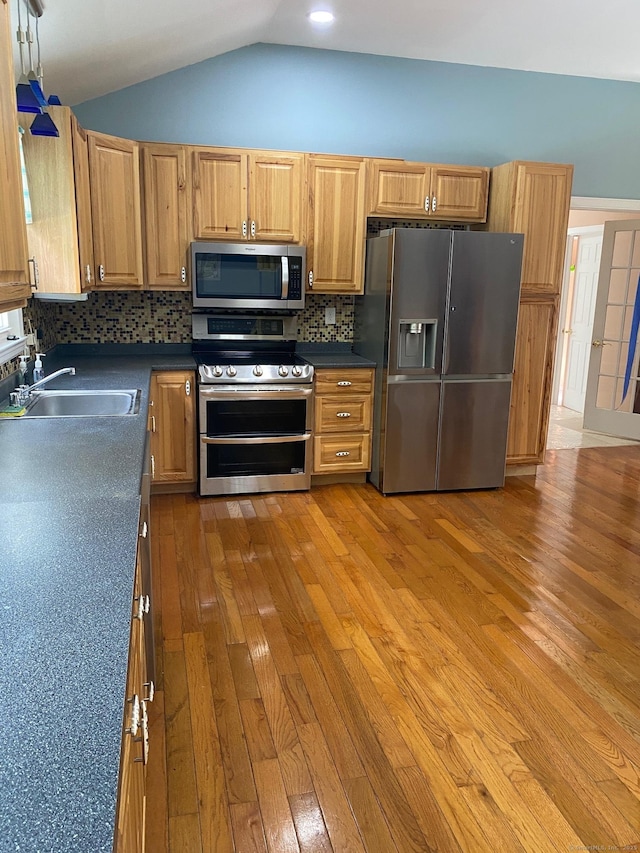 18 Bch Park Rd, Clinton, CT 06413 - kitchen featuring stainless steel appliances, dark countertops, light wood finished floors, backsplash, and vaulted ceiling