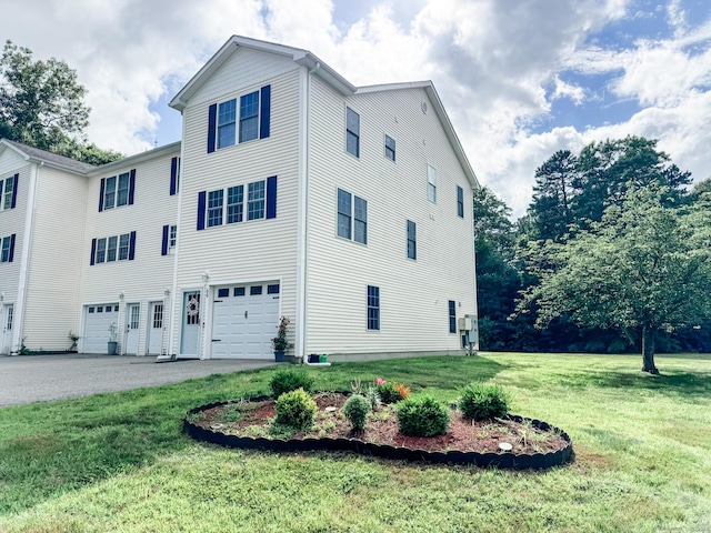 60 Sachem Dr Unit 60, Plainfield, CT 06374 - view of side of property featuring a garage and a yard
