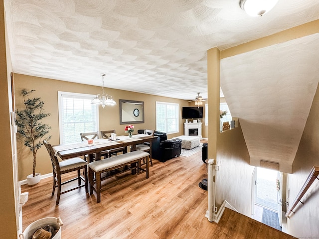 60 Sachem Dr Unit 60, Plainfield, CT 06374 - dining area featuring ceiling fan, a fireplace, and light wood-style floors