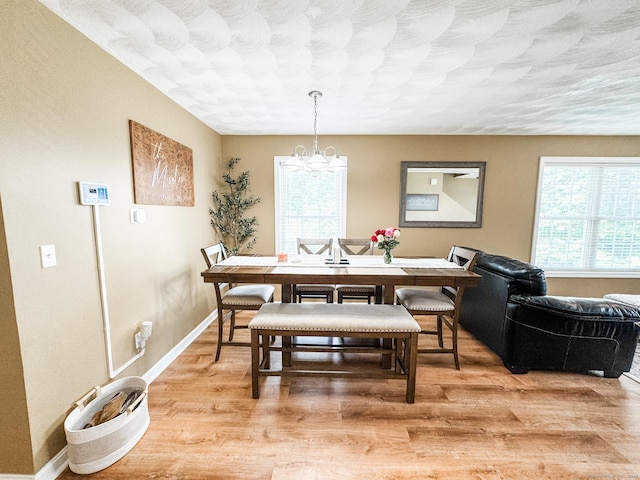60 Sachem Dr Unit 60, Plainfield, CT 06374 - dining area with a chandelier and light wood-type flooring