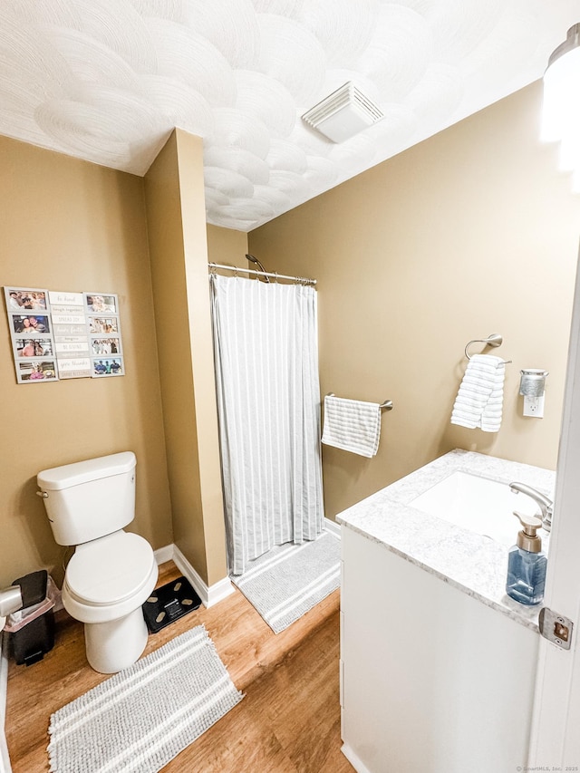 60 Sachem Dr Unit 60, Plainfield, CT 06374 - full bathroom featuring wood finished floors, vanity, and a shower with shower curtain