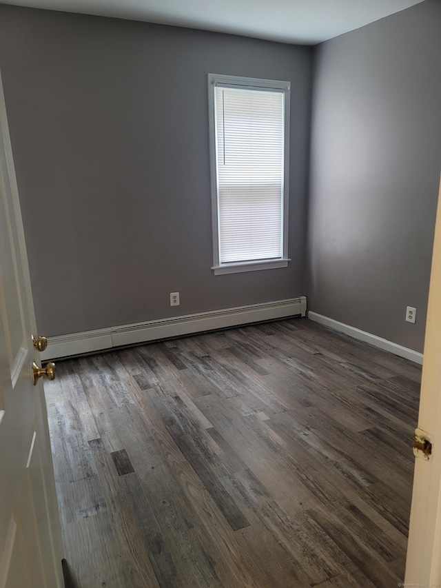 41 Mahl Ave, Hartford, CT 06154 - empty room with baseboard heating and dark wood-type flooring