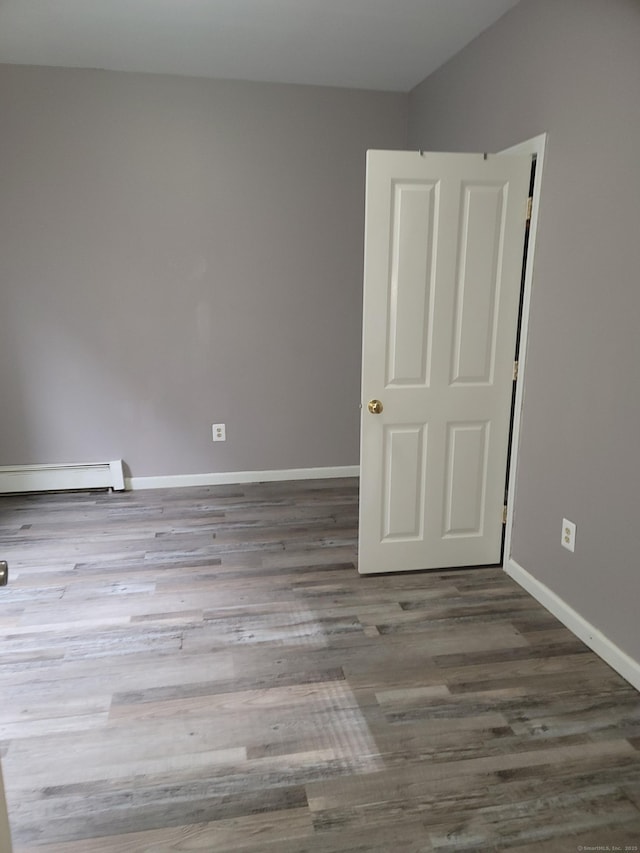 41 Mahl Ave, Hartford, CT 06154 - spare room with a baseboard heating unit and wood finished floors