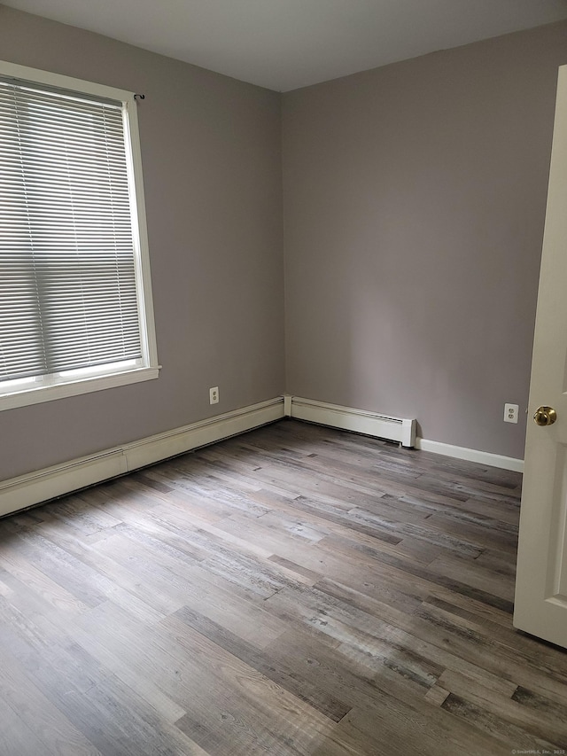 41 Mahl Ave, Hartford, CT 06154 - empty room with wood finished floors and baseboard heating
