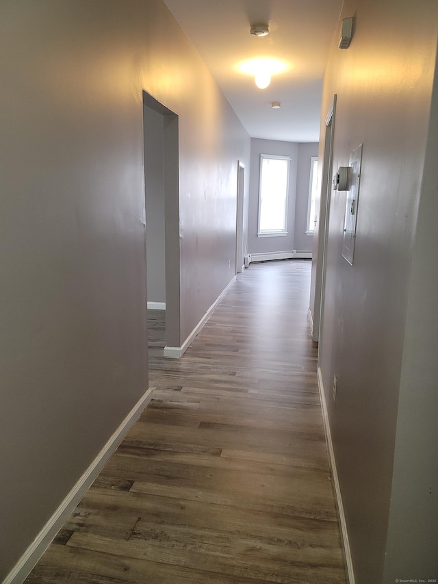 41 Mahl Ave, Hartford, CT 06154 - corridor featuring dark wood-style floors and a baseboard heating unit