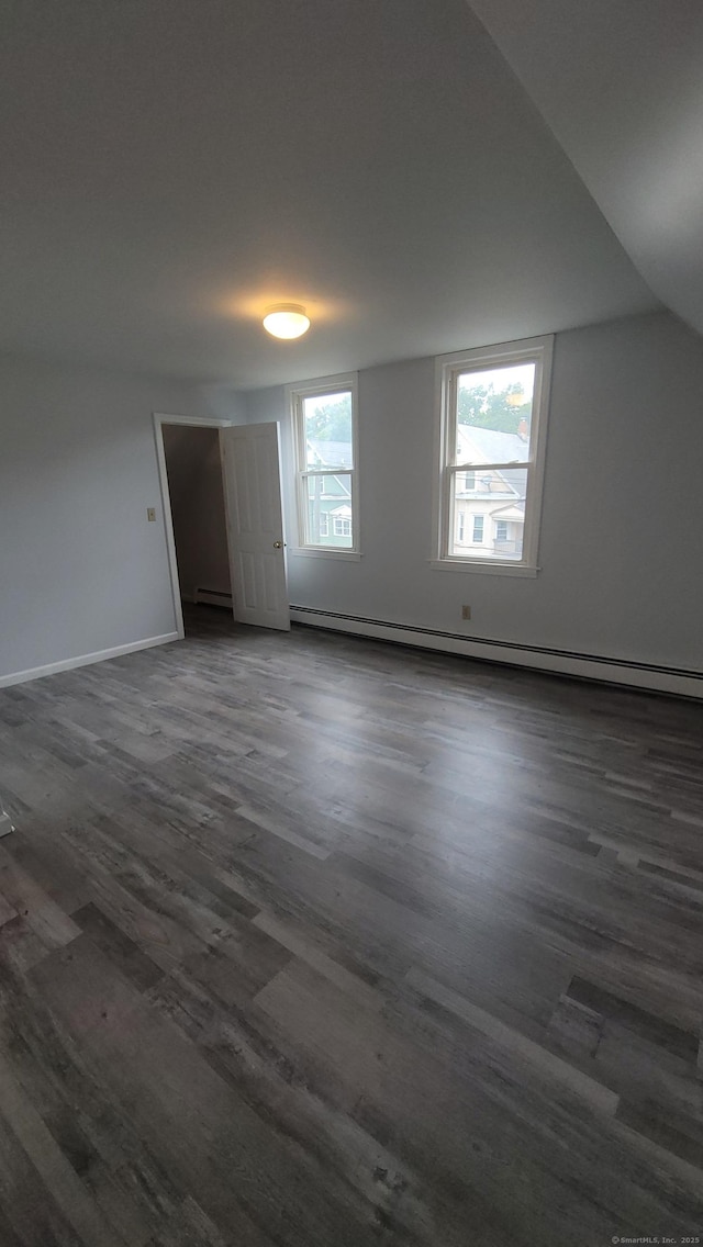 41 Mahl Ave, Hartford, CT 06154 - unfurnished room with dark wood-type flooring, a baseboard heating unit, and vaulted ceiling