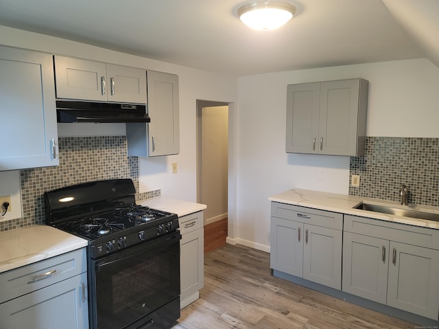 41 Mahl Ave, Hartford, CT 06154 - kitchen featuring black gas range oven, under cabinet range hood, and gray cabinets