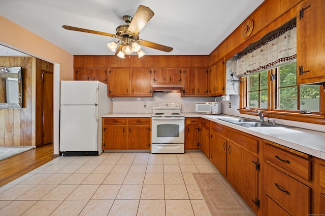233 Mountain Rd, Cheshire, CT 06410 - kitchen featuring white appliances, under cabinet range hood, light countertops, and brown cabinets