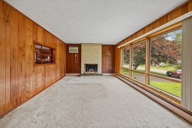 233 Mountain Rd, Cheshire, CT 06410 - unfurnished living room with a baseboard heating unit, plenty of natural light, carpet, a wall unit AC, and wooden walls