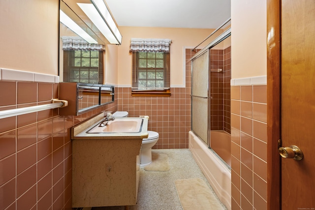 233 Mountain Rd, Cheshire, CT 06410 - full bath with tile walls, vanity, bath / shower combo with glass door, and a wainscoted wall