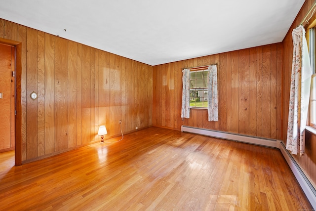 233 Mountain Rd, Cheshire, CT 06410 - empty room featuring a baseboard radiator, wood finished floors, and wooden walls