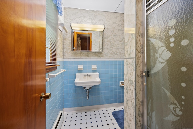 233 Mountain Rd, Cheshire, CT 06410 - bathroom with tile walls, a baseboard heating unit, a wainscoted wall, a stall shower, and tile patterned floors
