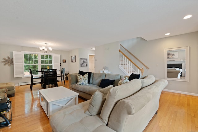 11 Adam Dr, Newington, CT 06111 - living area with a chandelier, a baseboard radiator, stairs, light wood-type flooring, and recessed lighting