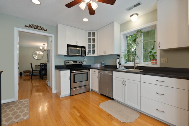 11 Adam Dr, Newington, CT 06111 - kitchen featuring appliances with stainless steel finishes, ceiling fan, white cabinets, dark countertops, and recessed lighting