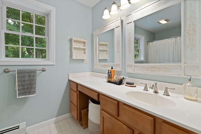 11 Adam Dr, Newington, CT 06111 - full bathroom with a baseboard heating unit, vanity, and tile patterned floors