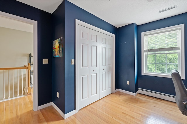 11 Adam Dr, Newington, CT 06111 - unfurnished office featuring hardwood / wood-style floors and baseboard heating