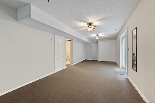 11 Adam Dr, Newington, CT 06111 - unfurnished room featuring ceiling fan, dark colored carpet, and a textured ceiling