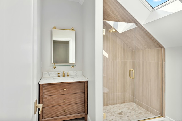 52 Garibaldi Ln, New Canaan, CT 06840 - bathroom featuring a skylight, a shower stall, vanity, and lofted ceiling