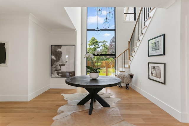 52 Garibaldi Ln, New Canaan, CT 06840 - foyer entrance with stairs and light wood-style floors